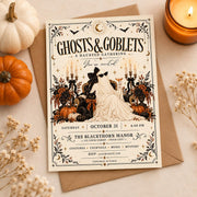 Ghosts and Goblets Halloween invitation displayed on a clean autumn flatlay with pumpkins, envelope, candle, and dried flowers.