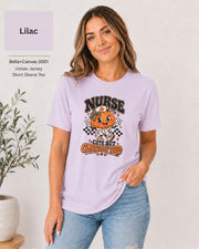 Woman wearing an Lilac Bella+Canvas 3001 unisex t-shirt featuring a cute pumpkin nurse graphic and the phrase “Nurse Cute But Clinically Tired.”