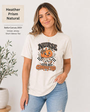 Woman wearing an Heather Prism Natural Bella+Canvas 3001 unisex t-shirt featuring a cute pumpkin nurse graphic and the phrase “Nurse Cute But Clinically Tired.”