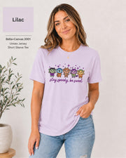 Bella+Canvas 3001 Lilac unisex T-shirt featuring five cute Halloween-inspired characters with stars and the phrase “Stay Spooky, Be Sweet” in a small centered chest design.