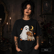 Black unisex T-shirt featuring a smiling white ghost beside a mummy-wrapped puppy wearing a witch hat, with a crescent moon, stars, and orange autumn leaves.