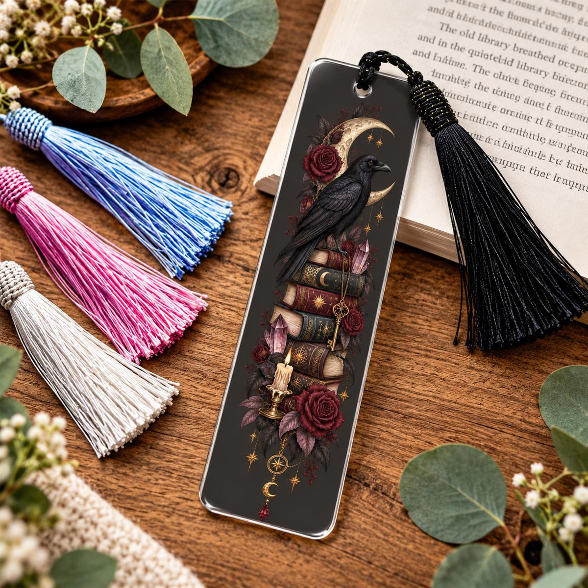 Gothic raven acrylic bookmark with black, white, pink, blue tassel featuring crescent moon, red roses, antique books, crystals, candle and vintage key.