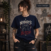 Midnight Comfort Colors 1717 shirt mockup with bold Nobody’s Bitch graphic, black cat illustration, grunge typography, and dark alternative styling.