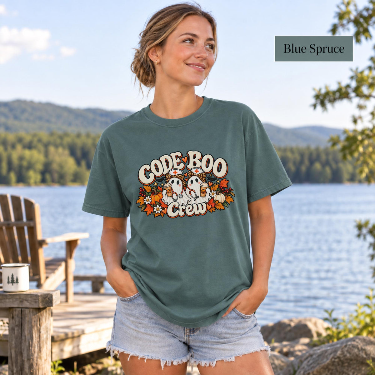 Blue Spruce Comfort Colors shirt displaying the retro nurse ghost graphic with orange, cream, and black Halloween details.