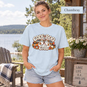 Chambray Comfort Colors T-shirt displaying the “Code Boo Crew” nursing graphic with ghost characters, stethoscopes, and fall elements.