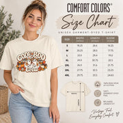 Comfort Colors size chart showing unisex T-shirt measurements, fit guidance, and sizing information for the Code Boo Crew nurse shirt.
