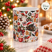 11 oz white ceramic mug featuring a wraparound spooky Christmas pattern with ghosts, black cats, gingerbread cookies, pumpkins, candy canes, ornaments, and holly.