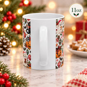 11 oz ceramic cup shown from the back, displaying the continuation of the Halloween-meets-Christmas wrap design with seasonal icons and bright accents.