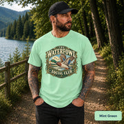 Mint Green shirt showcasing the “Waterfowl Social Club” graphic with a flying duck and vintage nature-inspired colors.