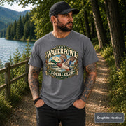 Graphite Heather shirt displaying the rustic duck badge graphic with earthy tones and nature-inspired elements.