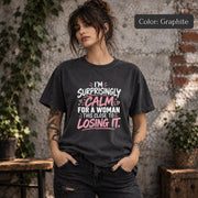 Graphite Comfort Colors 1717 T-shirt featuring the phrase “I’m Surprisingly Calm for a Woman This Close to Losing It” in pink and white lettering.