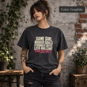 Graphite Comfort Colors 1717 T-shirt featuring the phrase “Same Girl Bigger Goals Stronger Coffee Less Bullshit Than Before” in distressed cream and pink lettering.