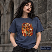 Heather Navy shirt displaying the festive turkey graphic in warm orange and cream tones with autumn foliage.