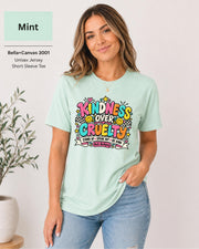 Heather Prism Mint shirt featuring the anti-bullying graphic with “Stand Up • Speak Out • Be Kind” text and cheerful colorful accents.