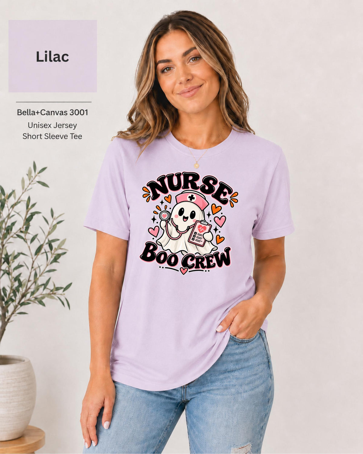 Nurse Boo Crew T-shirt in Lilac featuring a cute ghost nurse with a pink cap, stethoscope, clipboard, hearts, and playful Halloween accents.