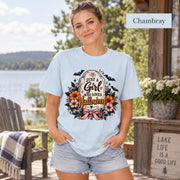 Just a Girl Who Loves Halloween T-shirt in chambray featuring a floral tombstone design with bats, orange and pink flowers, hearts, sparkles, and a pink bow.