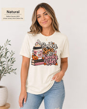 Bella+Canvas 3001 Natural unisex T-shirt featuring a “Pumpkin Spice & Spooky Vibes” design with a ghost reading, fall coffee, stacked books, jack-o’-lantern, hearts, and autumn leaves.