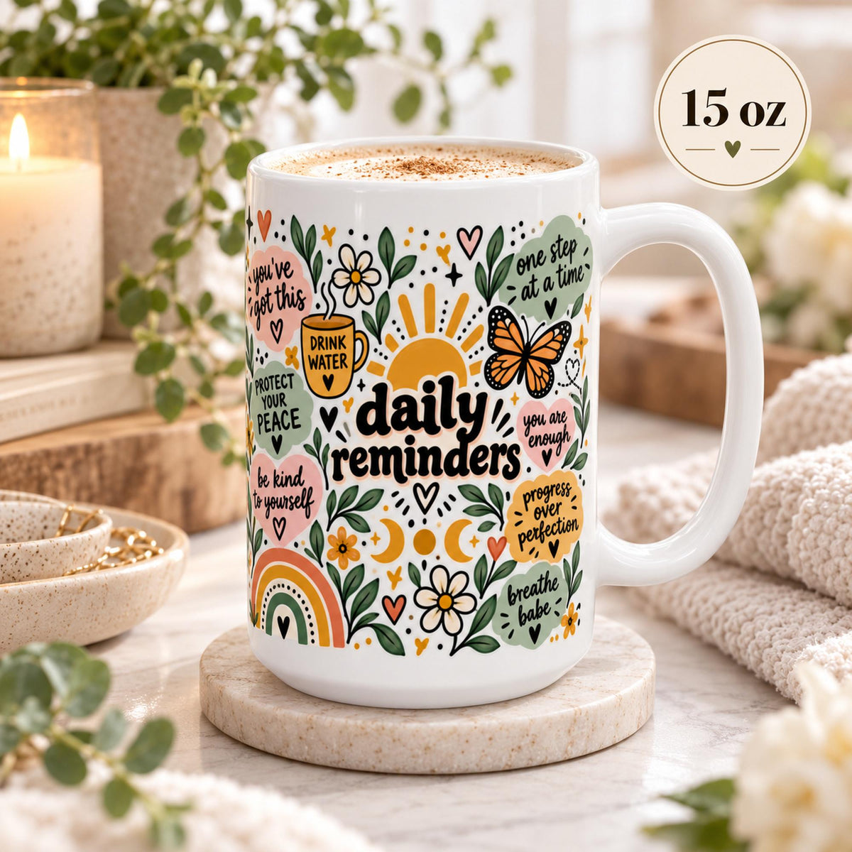 Daily Reminders ceramic mugs in 15 oz featuring colorful floral, sunshine, heart, and moon artwork with positive self-care phrases including drink water, be kind to yourself, you are enough, one step at a time, and progress over perfection.