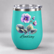 Teal 12oz wine tumbler featuring the watercolor birth flower design with green leaves and custom script name.