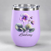 Light purple stemless wine tumbler featuring the watercolor violet birth flower and custom name in elegant black lettering.