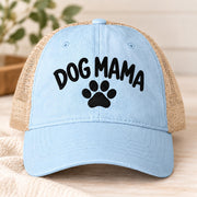 Cashmere blue cap displaying the embroidered Dog Mama message with paw print and tan mesh panels.