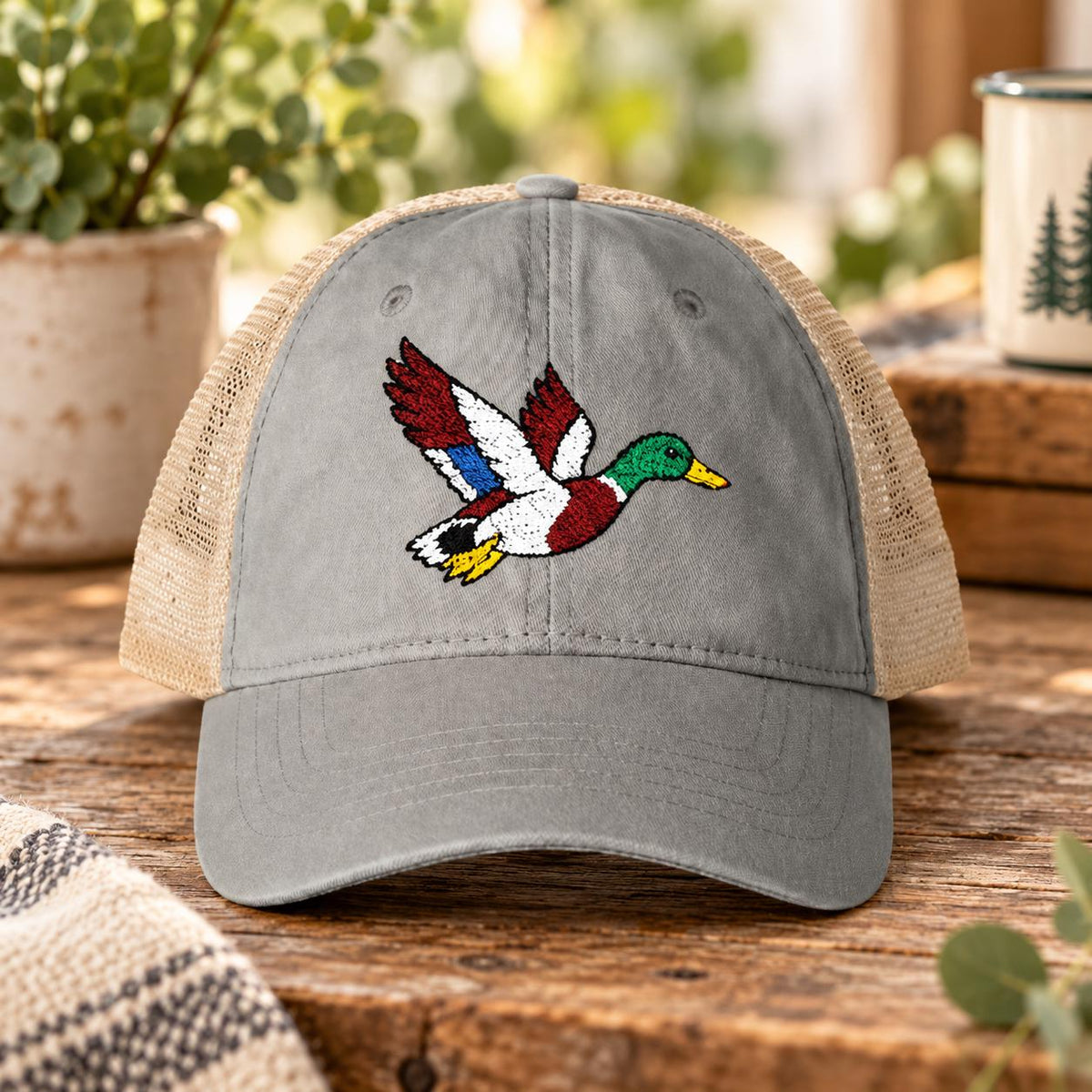 Light grey women’s washed hat featuring the flying mallard embroidery with breathable mesh back.