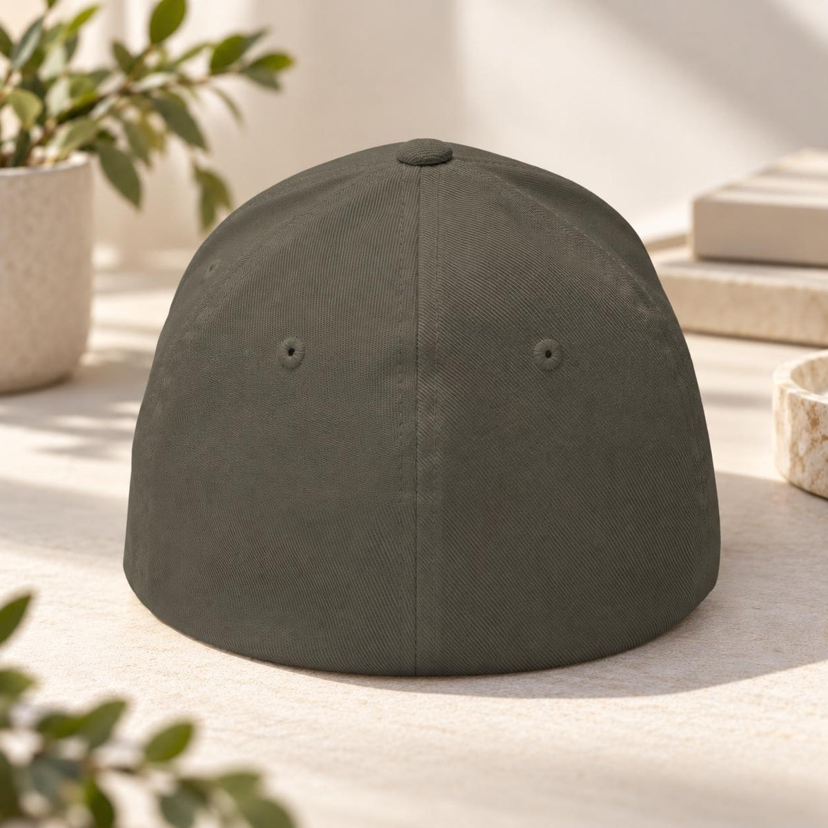 Back view of the dark olive Flexfit hat showing the closed-back stretch-fit construction and structured crown.