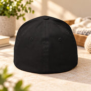 Back view of the black Flexfit cap showing the closed-back stretch-fit construction and structured crown.