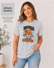 Woman wearing an Athletic Heather Bella+Canvas 3001 unisex t-shirt featuring a cute pumpkin nurse graphic and the phrase “Nurse Cute But Clinically Tired.”
