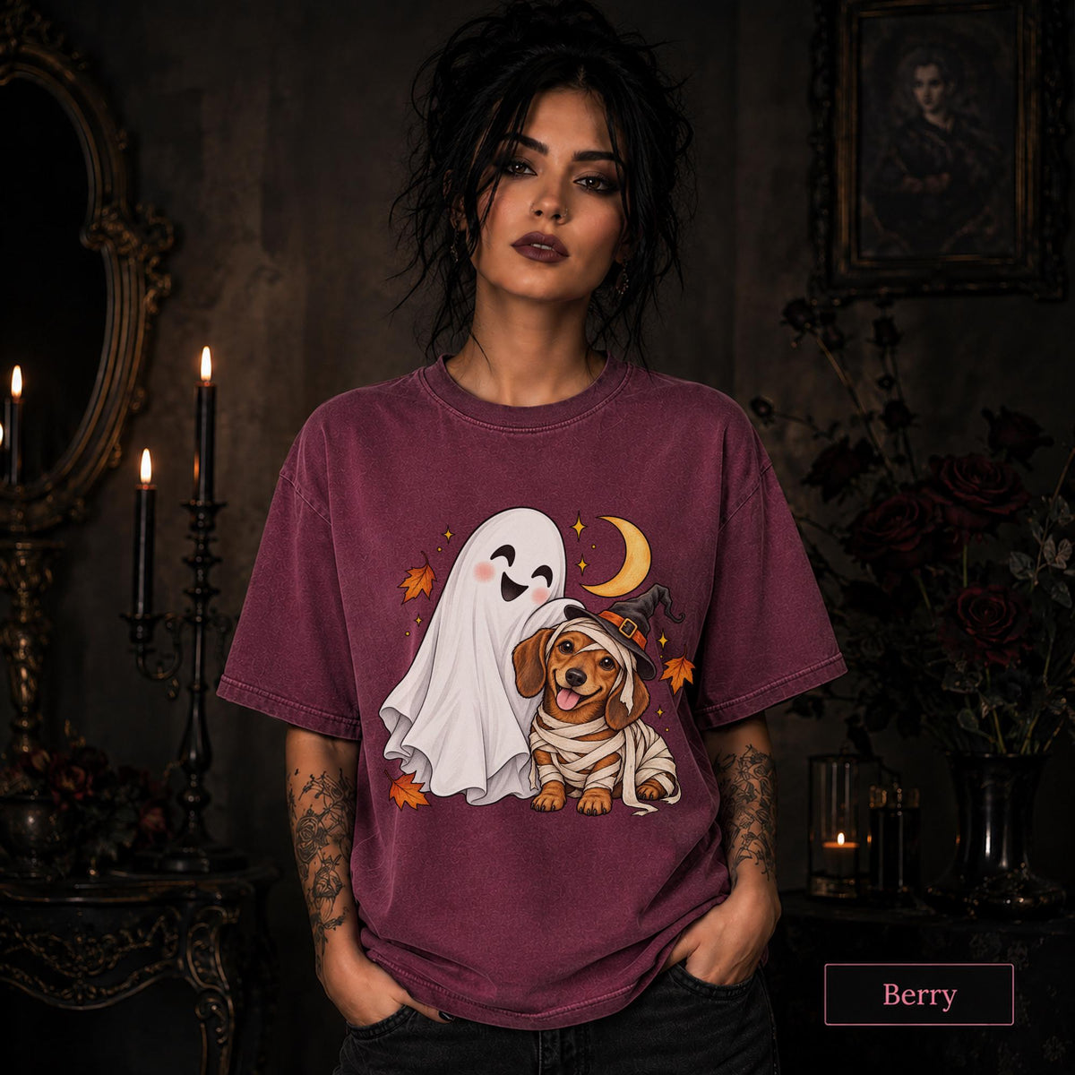 Berry unisex T-shirt featuring a smiling white ghost beside a mummy-wrapped puppy wearing a witch hat, with a crescent moon, stars, and orange autumn leaves.