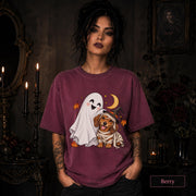 Berry unisex T-shirt featuring a smiling white ghost beside a mummy-wrapped puppy wearing a witch hat, with a crescent moon, stars, and orange autumn leaves.