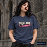 Heather Navy unisex tee featuring the empowering “Same Girl, Bigger Goals” graphic with contrasting cream and pink lettering.
