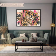 Digital leopard wall decor shown above a dark green sofa in a styled living room, highlighting the bold pink, black, cream, and botanical details.