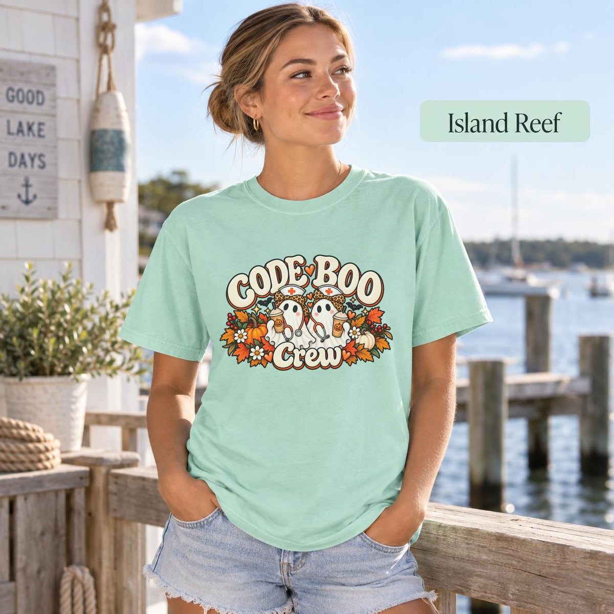 Island Reef Comfort Colors tee featuring the retro Halloween nurse artwork with two ghost nurses, pumpkins, and seasonal florals.