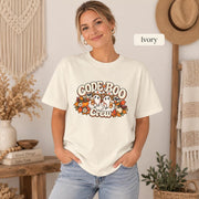 Ivory Comfort Colors T-shirt with the Halloween nursing graphic featuring ghost nurses, stethoscopes, pumpkins, and autumn foliage.