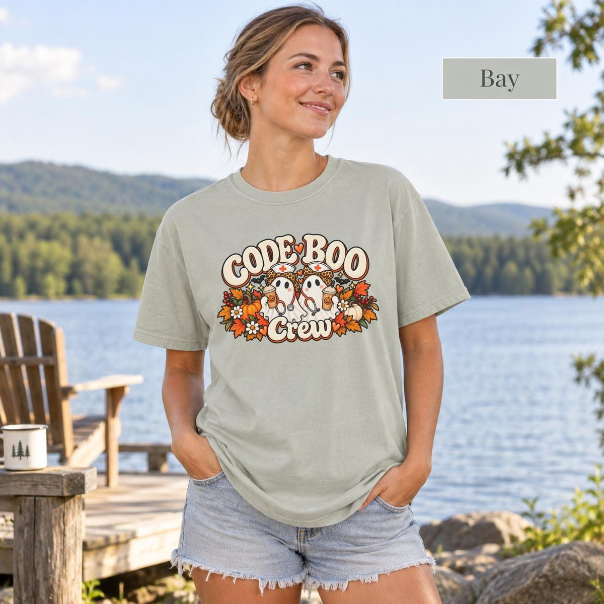 Bay Comfort Colors shirt showcasing the “Code Boo Crew” nurse design with warm fall colors and playful spooky details.