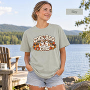 Bay Comfort Colors shirt showcasing the “Code Boo Crew” nurse design with warm fall colors and playful spooky details.
