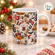 11 oz coffee mug angled to show the full patterned artwork with black cats, gingerbread characters, pumpkins, ornaments, candy canes, and festive foliage.