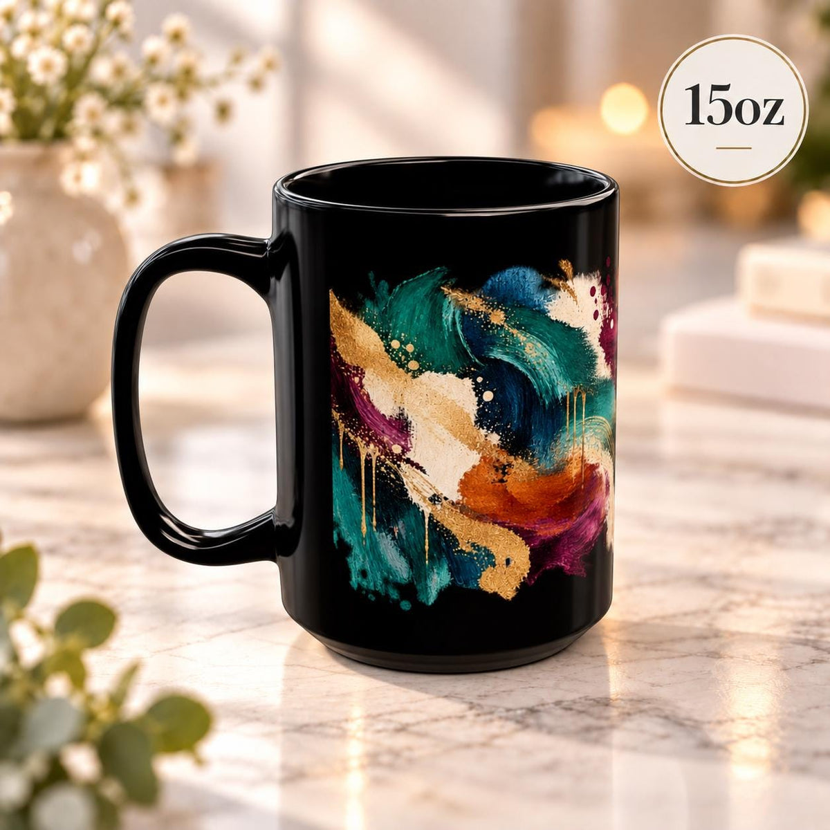 15 oz black coffee cup angled to showcase the full painterly pattern in teal, cobalt, cream, gold, and burgundy tones.