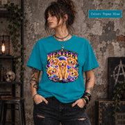 Woman modeling a topaz blue graphic T-shirt featuring Bentley's personalized cosmic dog portrait with vibrant blue, purple and orange space-inspired artwork.