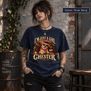 Woman wearing a True Navy Comfort Colors graphic T-shirt featuring a personalized dog photo design with the name Chester, vintage lettering and warm-toned artwork.