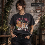 Model wearing a Pepper T-shirt with colorful dog lover artwork featuring four happy dogs, distressed pink lettering, white flowers and playful hearts.