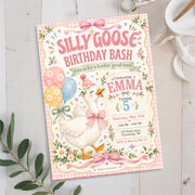Silly Goose birthday invitation displayed upright in a soft floral setting, featuring a white goose wearing a pink party hat, pastel balloons and editable birthday party details.