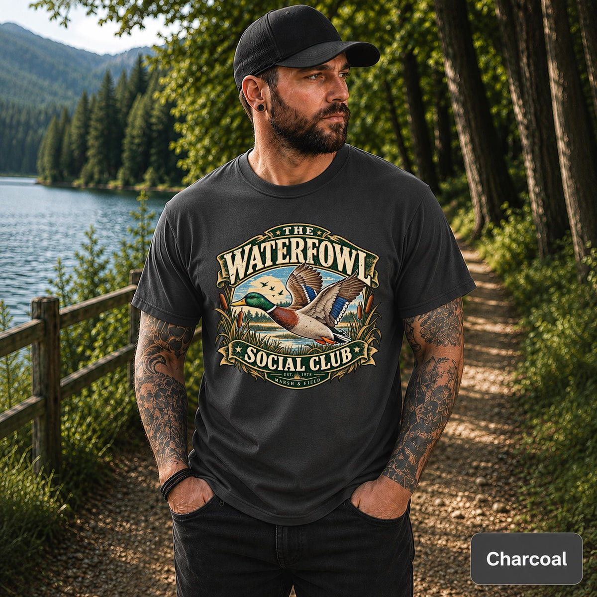 Dark Heather tee featuring the mallard duck artwork with marsh scenery and classic club-style typography.