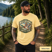 Yellow Haze shirt featuring the vintage duck design with green, tan, blue, and cream outdoor details.