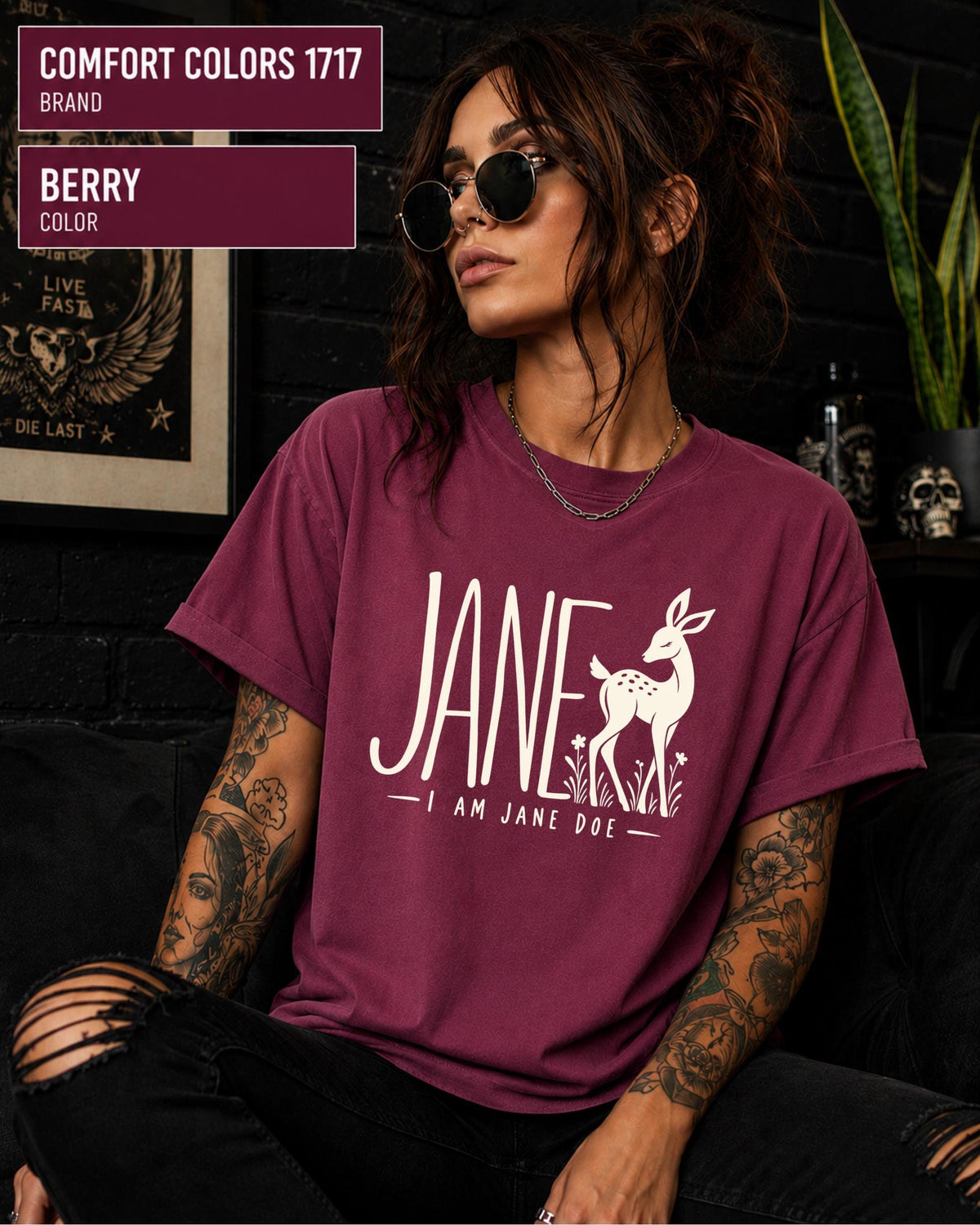 Berry Comfort Colors tee displaying the Jane Doe solidarity design with cream lettering and a simple deer graphic.
