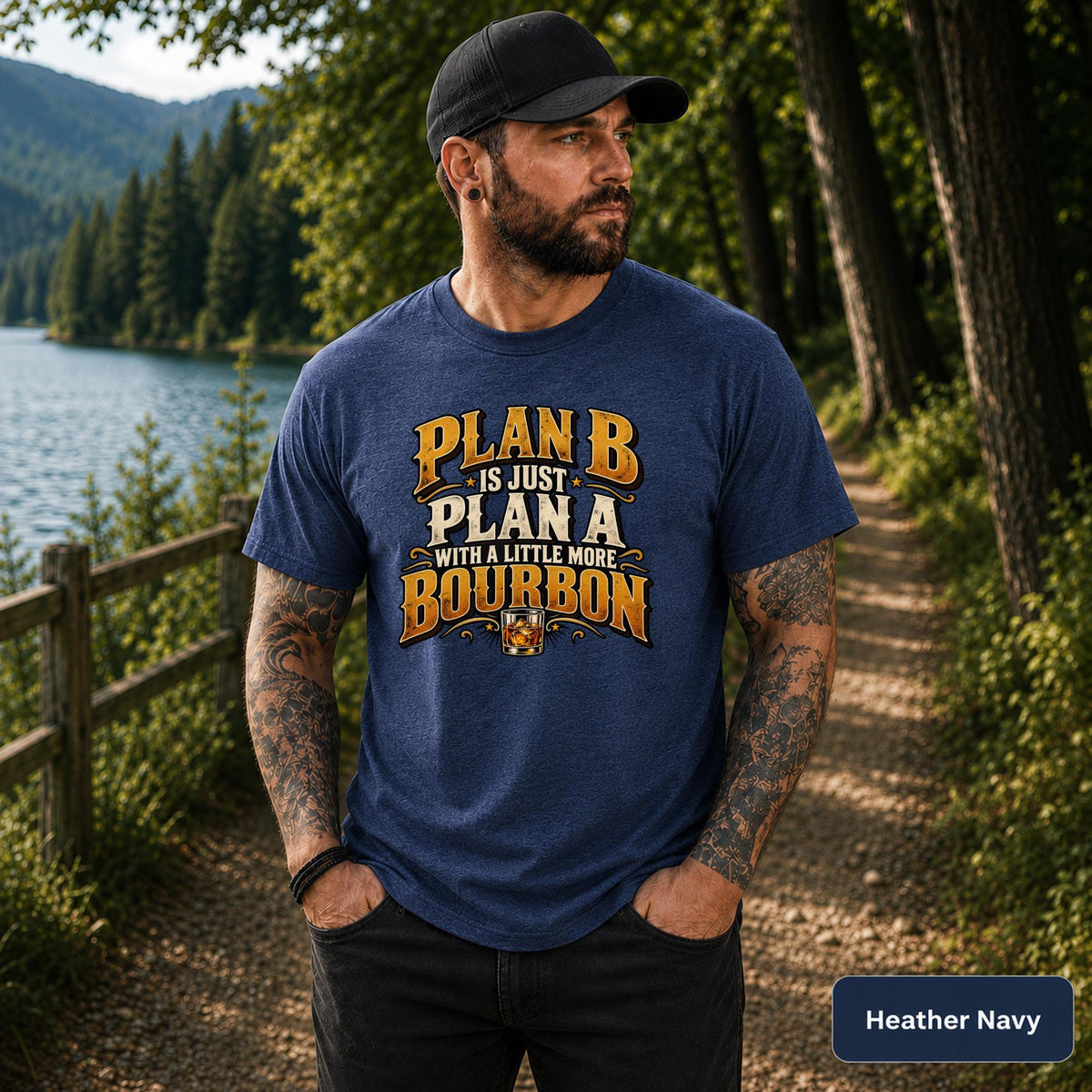 Heather Navy tee featuring the bourbon humor graphic in gold, cream, and amber tones for a casual outdoors look.