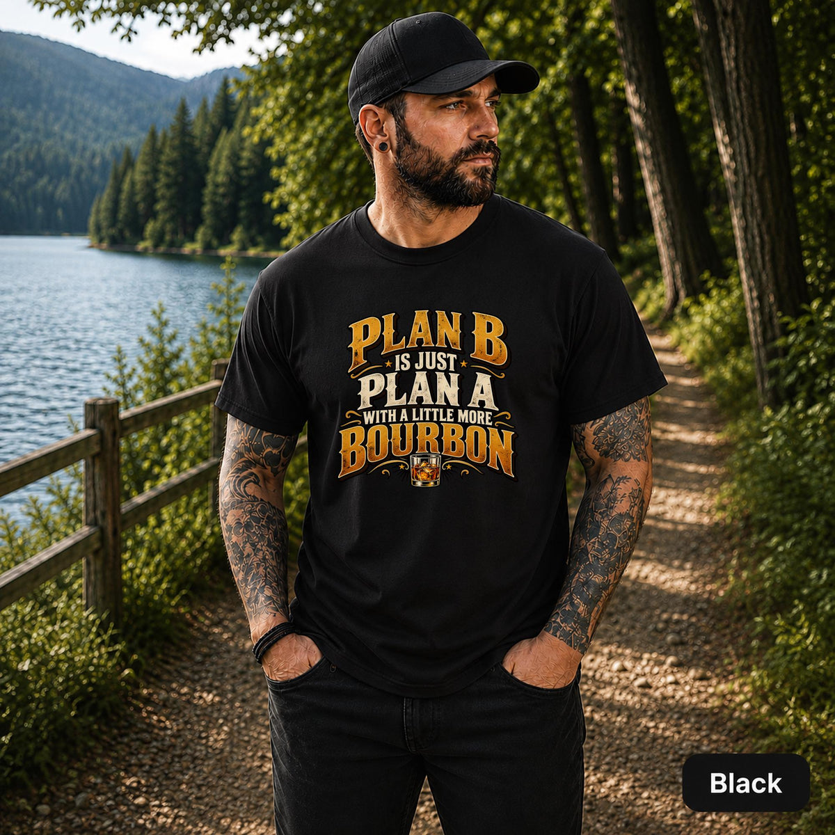 Black unisex T-shirt featuring the phrase “Plan B Is Just Plan A With a Little More Bourbon” in distressed gold and cream lettering with a whiskey glass graphic.