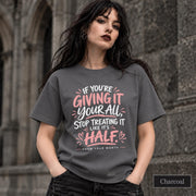 Charcoal shirt displaying the motivational self-worth message with bold hand-lettered typography and heart accents.