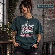 Blue Spruce Comfort Colors 1717 shirt featuring the “Surprisingly Calm” quote in a bold graphic layout.